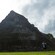 A young man taking a picture of a Mayan pyramid
